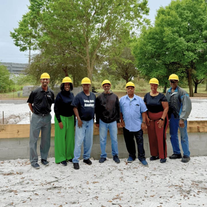 Community partners gather at a construction site to celebrate a local development project, reflecting U.S. Sugar's commitment to strengthening rural communities and building the future of American food production through long-term investment and collaboration.