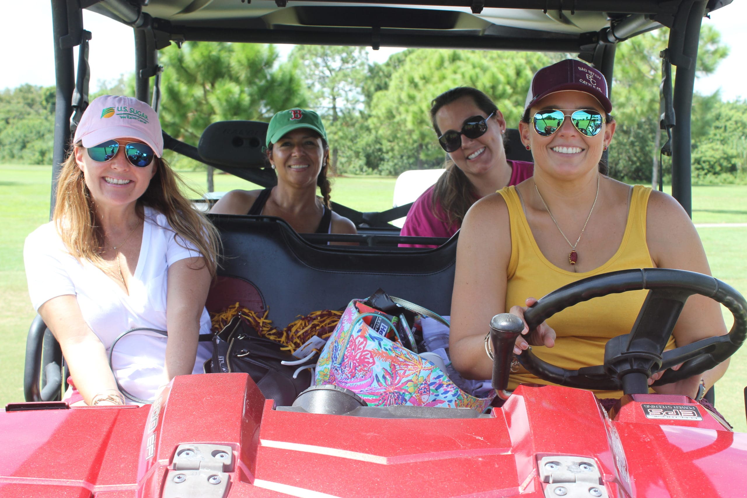 Emily Kurtz, Ashly Sergent, Velma Alvarado and Ann Marie Pilling cruise the fairway in between holes.