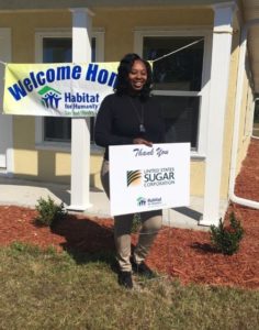 Devnish Seales receives the keys to her new house in LaBelle thanks to Habitat for Humanity and U.S. Sugar