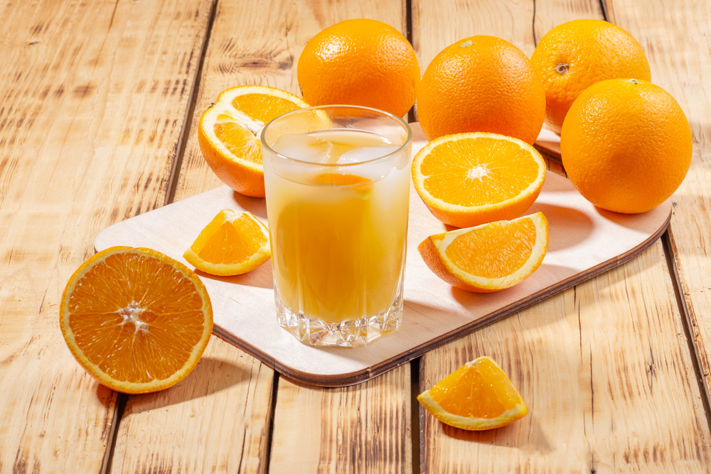 A,Glass,Of,Orange,Juice,With,Ice,Cubes,And,A