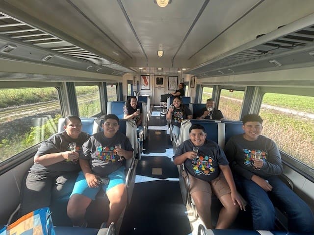 children posing for a photo on a bus