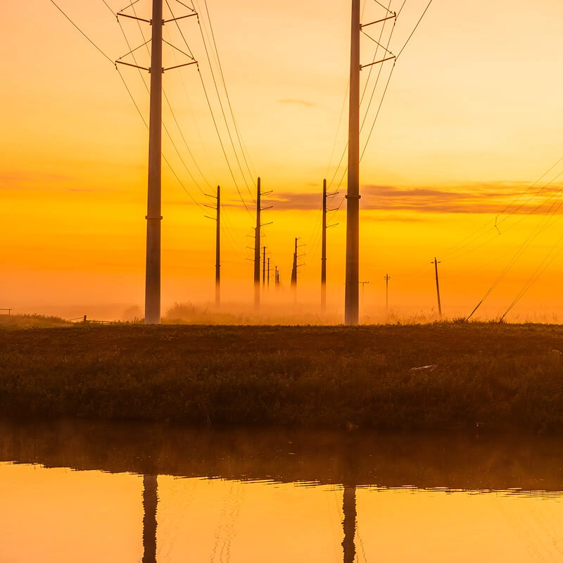 Utility poles at dusk