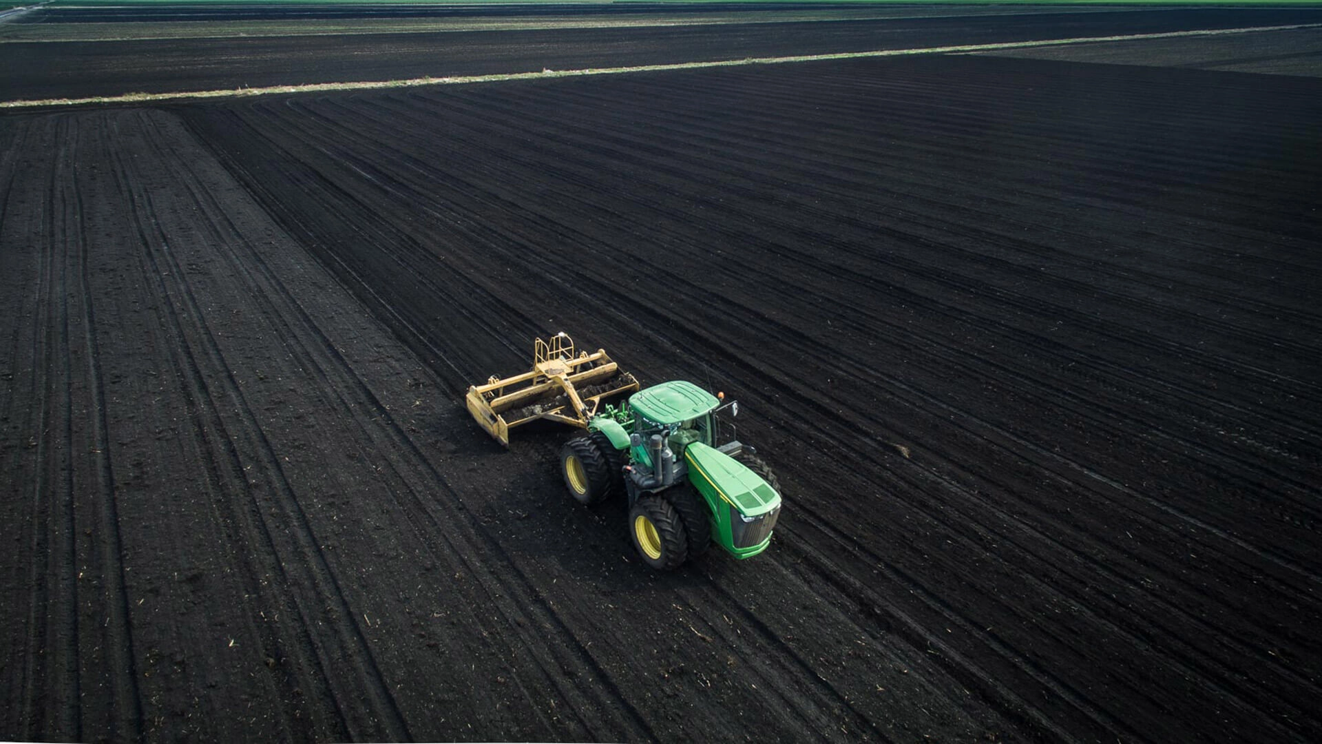 Tractor harvesting field