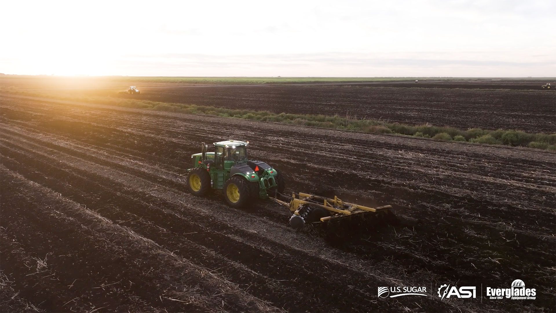 Autonomous John Deere tractor operating in a South Florida sugarcane field as part of U.S. Sugar’s large-scale deployment of precision agriculture technology